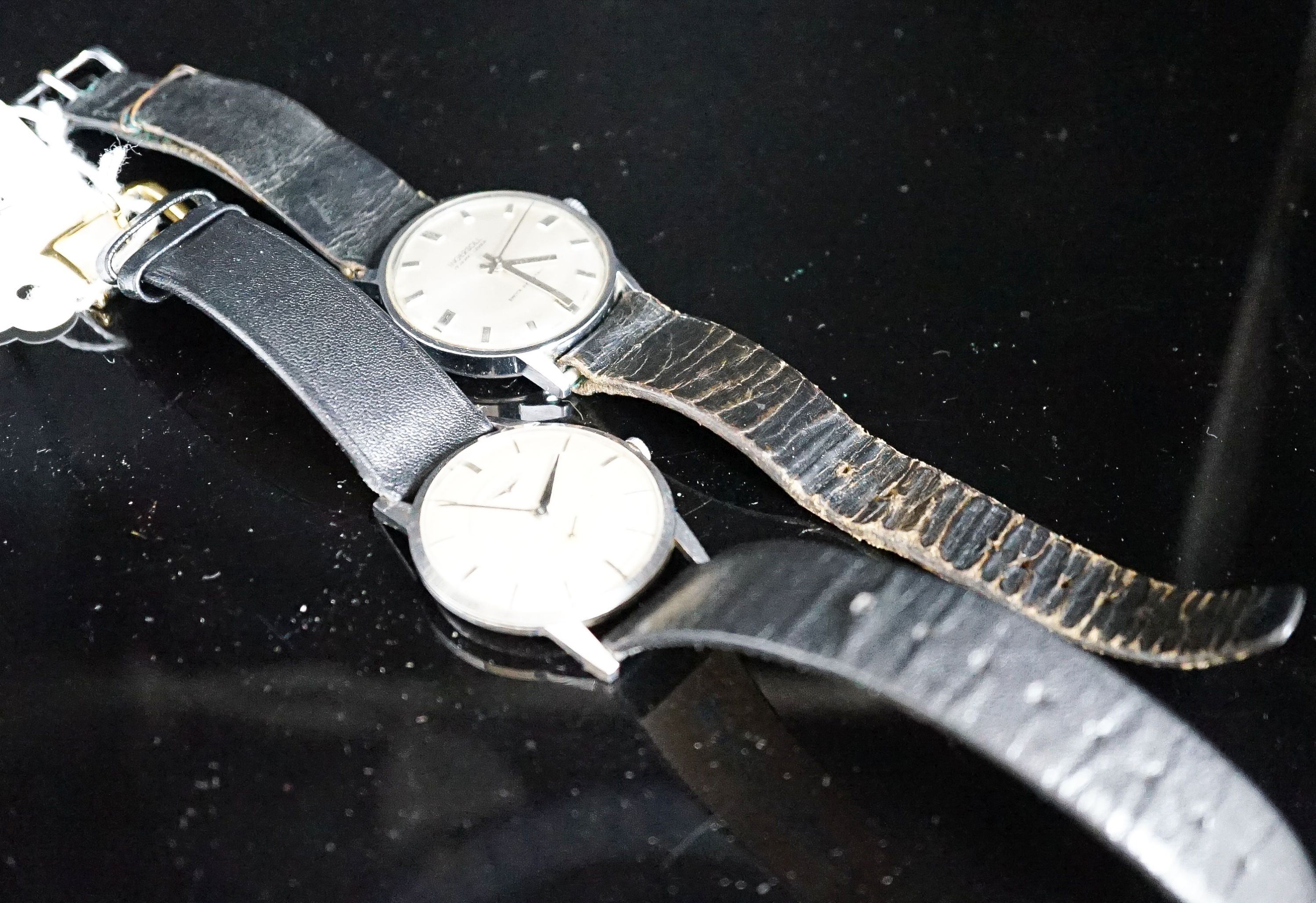 A gentleman's stainless steel Longines manual wind wrist watch, cased diameter 35mm and a similar Ingersol watch.